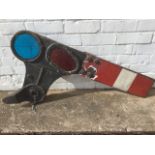 An Edwardian cast iron railway signal with red & green rounded glass windows, and red & white