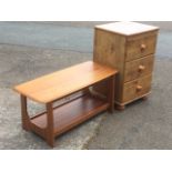 A dwarf pine chest with three knobbed drawers raised on bun feet; and a 70s teak coffee table with