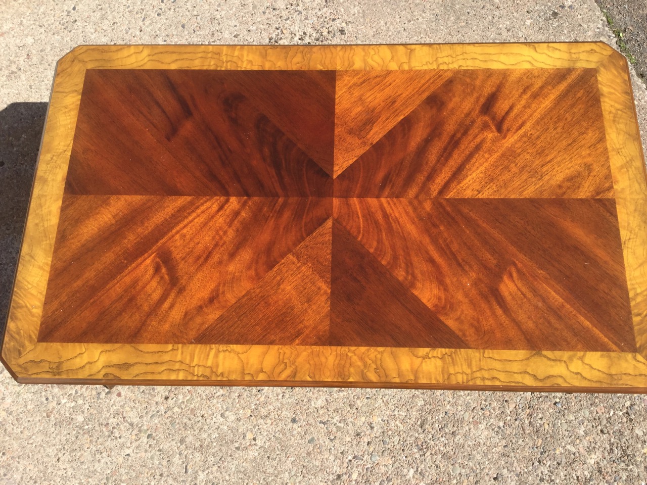 A walnut coffee table, the quarter veneered crossbanded top with canted corners above a frieze - Image 3 of 3