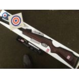 A boxed SMX high power .22 air rifle, complete with a 4x10 scope, instructions, targets, etc. (A