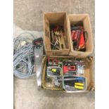 A quantity of tools including hammers, nails, drill bits, pliers, a long extension cable, files,