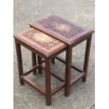 A graduated pair of hardwood coffee table, the rectangular moulded tops with brass inlay and foliate