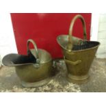 Two helmet shaped brass coal scuttles with rolled rims, having tubular swing handles. (2)