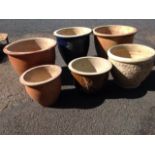 Six circular stoneware garden pots - some glazed, some with floral decoration, etc. (6)