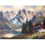 A Fenke, oil on canvas, lake landscape with mountains & log cabin, signed & gilt framed.