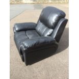 A contemporary leather reclining armchair, with padded back, arms and seat, complete with integral