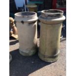 A tubular tapering stoneware chimney pot with moulded rim; and another similar with plinth. (2)