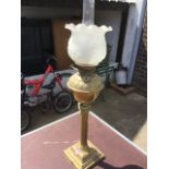 A large Victorian brass oil lamp