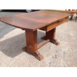 A deco oak draw-leaf dining table