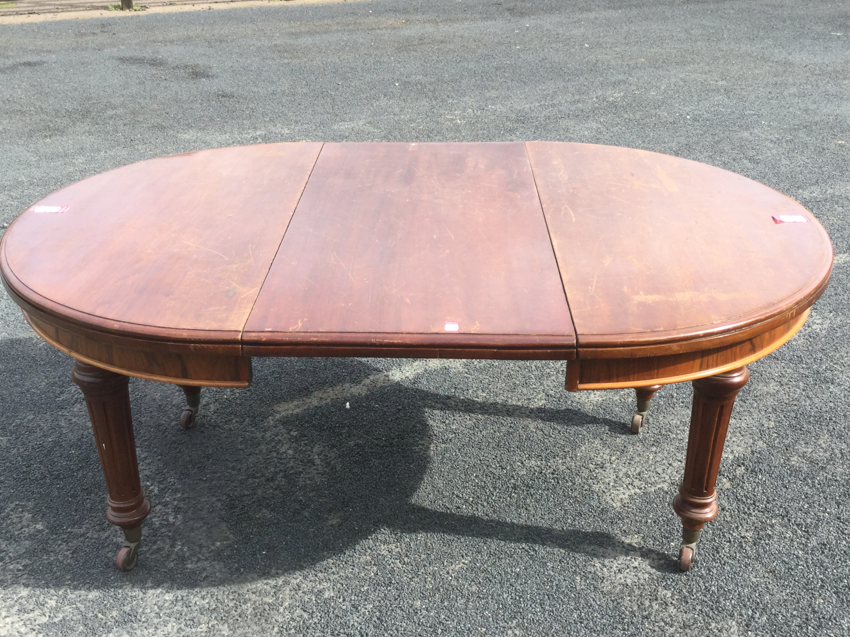 A Victorian walnut dining table with telescopic action and spare leaf - Image 3 of 3