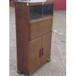 A 50s oak bureau cupboard