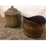 A helmet shaped brass coal scuttle; and a tubular coal bin of chamfered form raised on three shaped