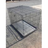 A large dog cage, the folding box with rectangular interior tray.