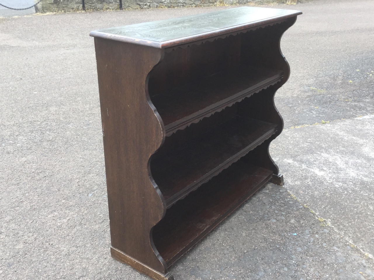 An oak open bookcase, the moulded shelves with shaped aprons, with waved sides. - Image 2 of 3