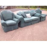 A three-piece suite, with loose covers & cushions, the chairs with arched backs & wings, the sofa