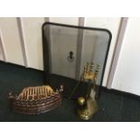 A brass companion set firetidy, with poker, shovel, brush & tongs on stand; a 13in cast firegrate