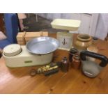 A set of Harper enamelled kitchen scales; a knife block; two brass Salter style scales; a 5kg cast