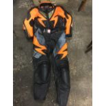 A Swiss made IXS leather motorbike suit with safety and elasticated panels, zips, pockets, etc