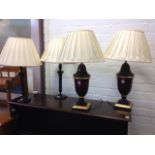 A pair of tablelamps with fluted columns and scrolled capitals on circular bases, fitted with