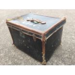 A late Victorian travel box with leather mounts and handle, the hessian case with brass lock.