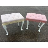 A pair of white dressing table stools with button upholstered rectangular seats on cabriole legs.