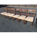A set of six late Victorian carved oak dining chairs