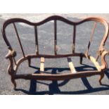 A Victorian serpentine shaped walnut sofa