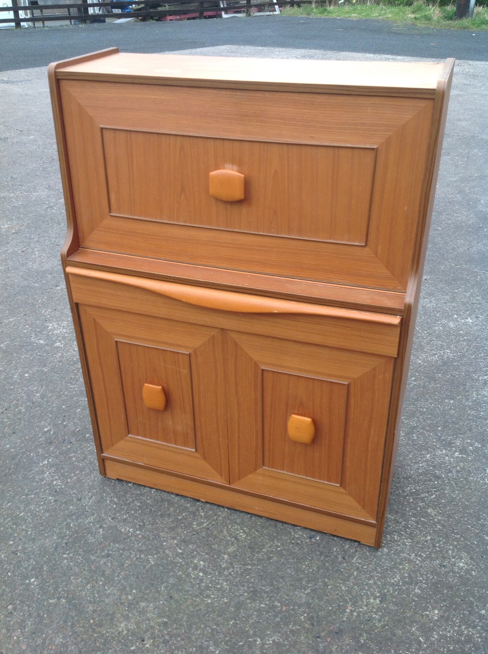 A 70s teak bureau with panelled fallfront