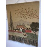 A contemporary craft wallhanging on hessian ground