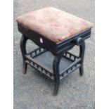 An ebonised late Victorian piano stool