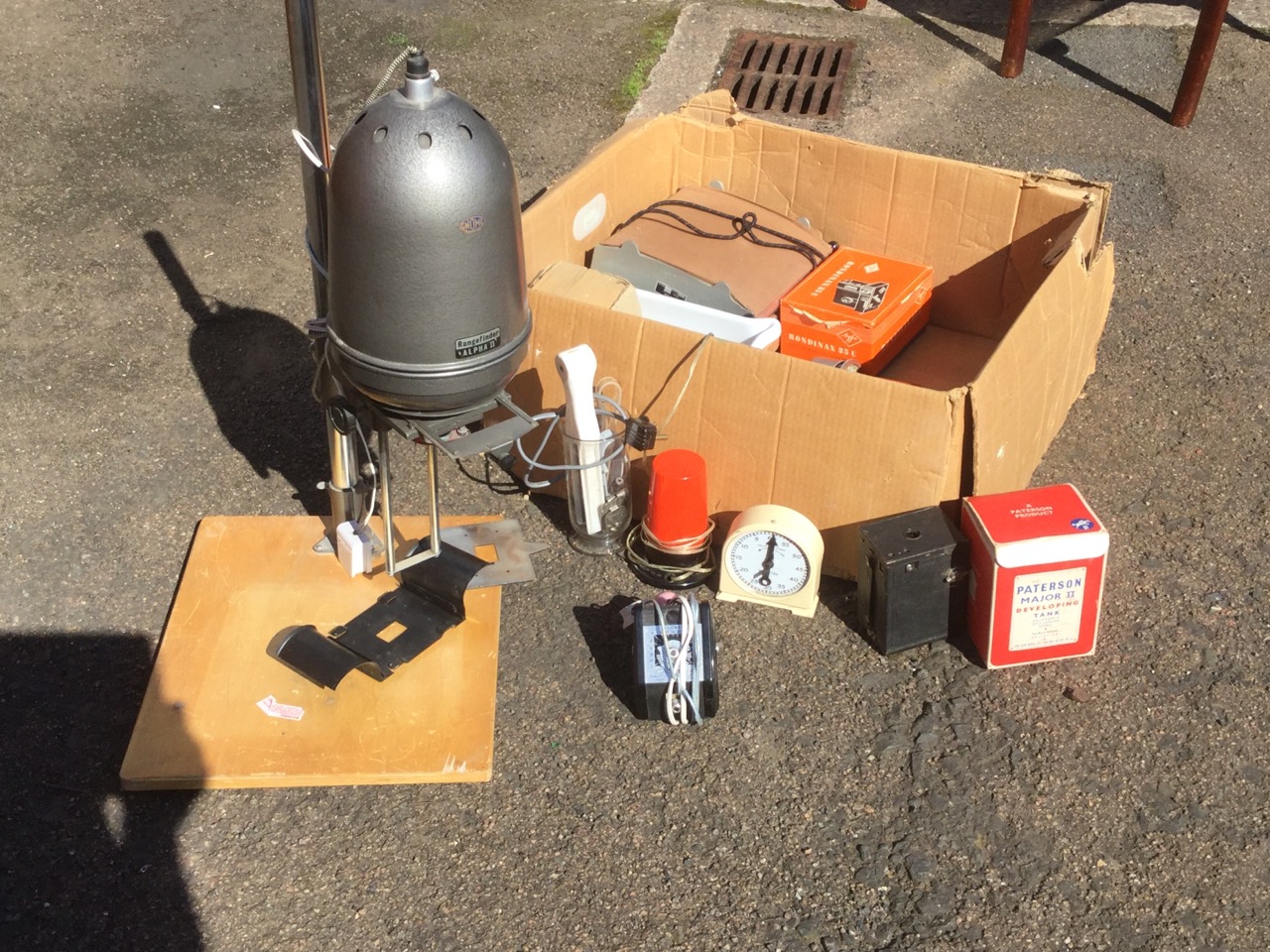 A quantity of darkroom equipment including an enlarger on stand