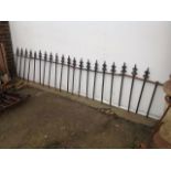 A run of wall-top railings, the poles with cast iron spear finials; and another set with square