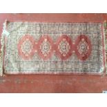 An oriental silk style rug