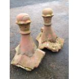 A pair of terracotta ridge finials, with rounded bun shaped tops