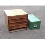 A wood retail cabinet with hinged top above drawers; and a metal filing cabinet. (2)