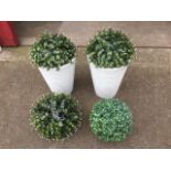 A pair of decorative fluted tapering pots; and two hanging garden balls. (4)