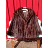 A Jenners mink fur jacket, the lined coat with wide lapels and cuffs.