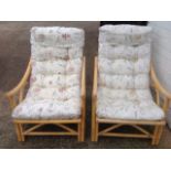 A pair of conservatory armchairs