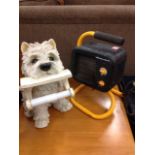 A portable Winterwarm electric heater in stand; and a bog roll holder modelled with a terrier. (2)