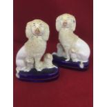 A pair of Victorian Staffordshire flatback dogs