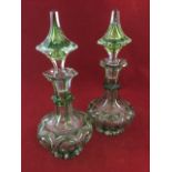 A pair of continental crystal glass perfume bottles & stoppers, with hexagonal chamfered necks