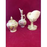 Three pieces of blush ivory Royal Worcester - a floral ewer, a nautilus spoonwarmer shell on stand