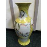 A Chinese famille jaune baluster vase