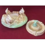 A Sylvac pastel glazed circular posy bowl modelled with three rabbits on naturalistic ground;