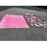 A pink Victorian cotton Durham quilt; a large knitted patchwork blanket with tasseled edging