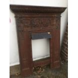A late Victorian cast iron fireplace with gadrooned moulding