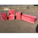 A pink velour upholstered bedroom suite