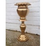 A large brass jardinere on stand