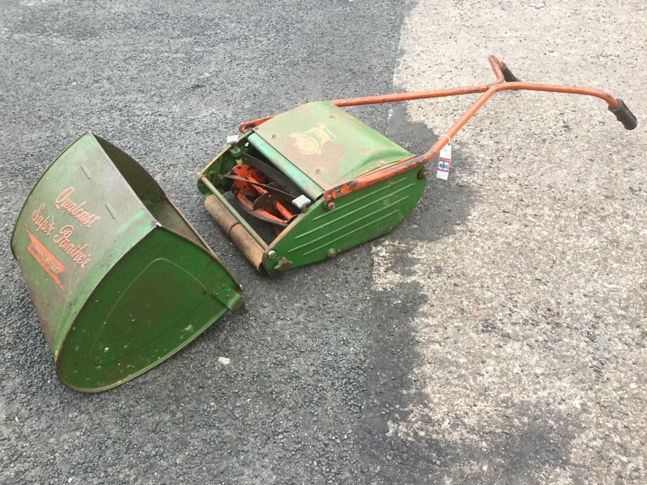 A Qualcast Super Panther push-along lawnmower with wood rollers, grassbox, angled handles, etc.
