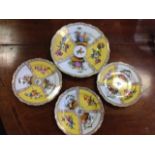 A set of three Meissen yellow ground plates, and one larger